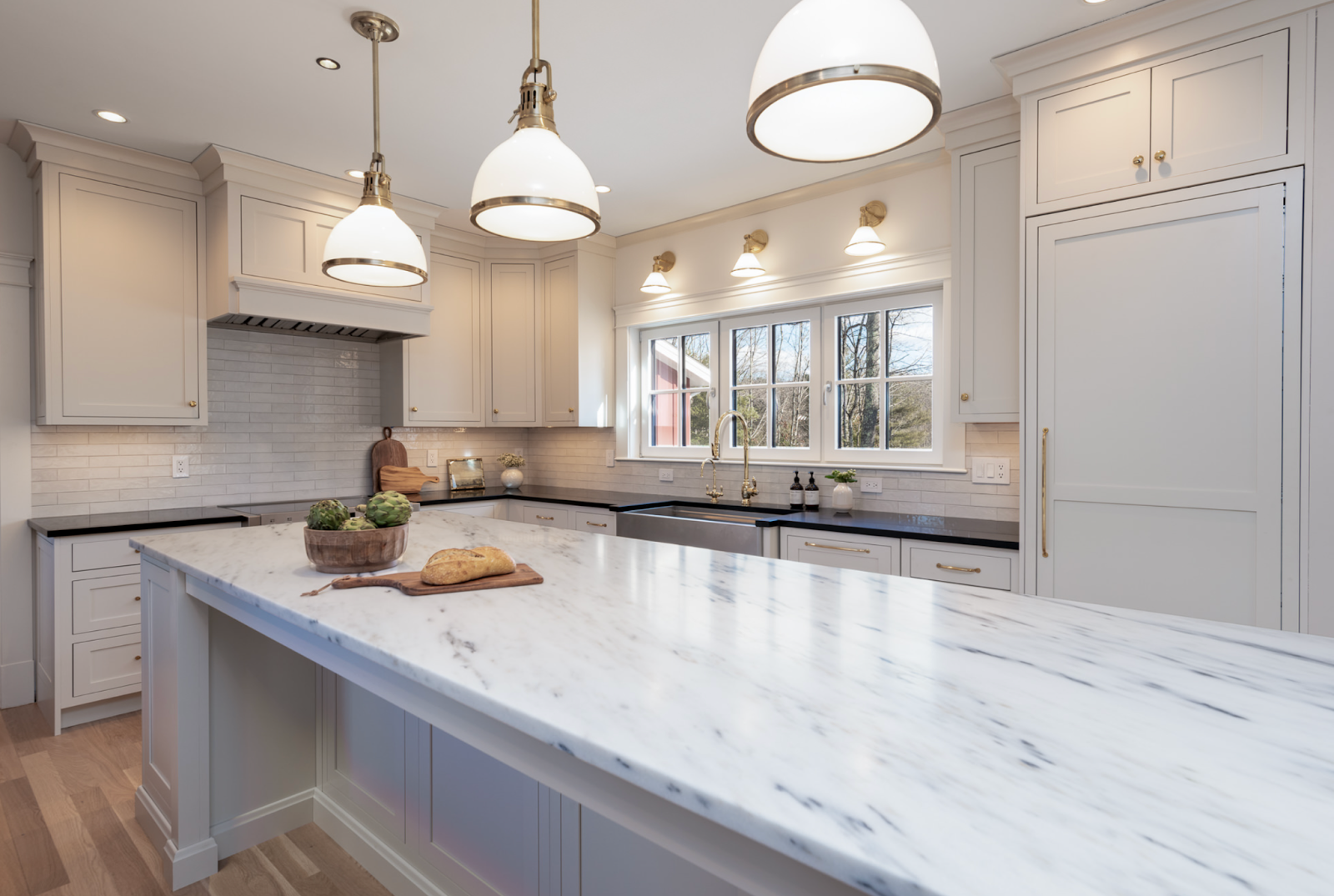 This image depicts a kitchen showcasing elegant inset cabinets, with doors that sit flush within the cabinet frame for a seamless appearance.