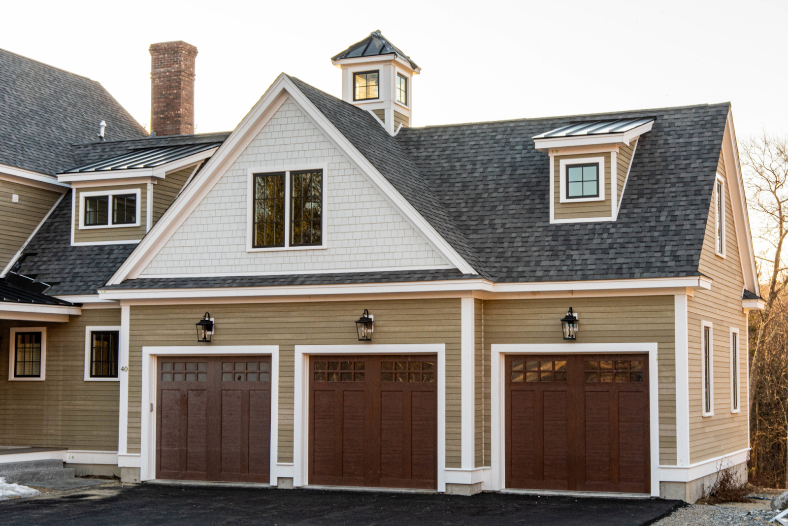 This image depicts a modern two-story house with beautiful, energy-efficient windows.