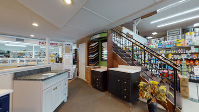 home improvement store interior with cabinets, countertop displays, and a staircase