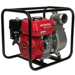 Red Honda water pump encased in a black metal frame, used for efficient water transfer and management solutions.