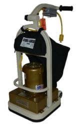 Industrial floor buffer machine with a black dust bag and a yellow power cord.