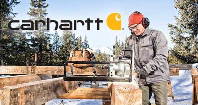 Person in winter gear using a chainsaw mill in a snowy forest setting, with logo visible in the background.
