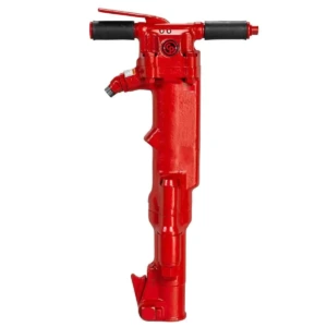 Red pneumatic jackhammer with black handles, used for breaking hard surfaces, isolated on a white background.