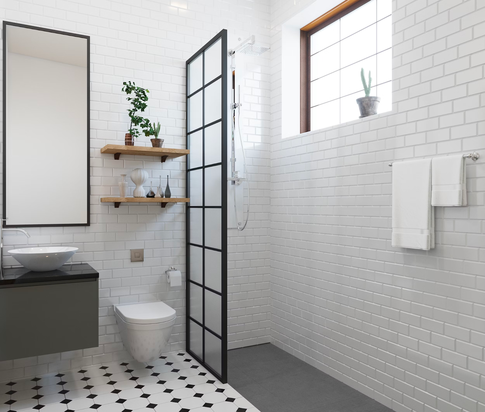 The picture depicts a minimalist bathroom with black and white tile flooring and white brick walls. The shower is separated from the toilet with a glass and black paneled door. 