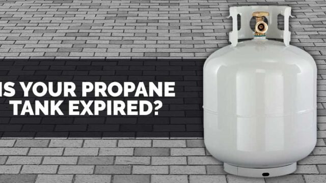 Propane tank next to text asking if it is expired, on a gray brick background.