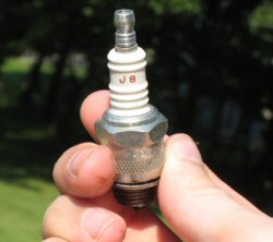 Pictured: A lawnmower spark plug