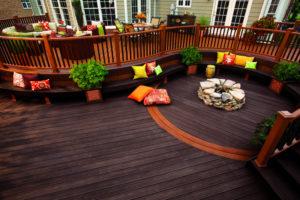 Deck with planters, fire pit, and games